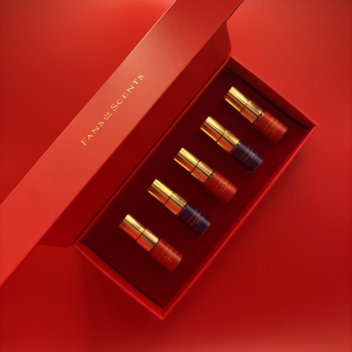 Open Fans of Scents discovery box with five perfume vials